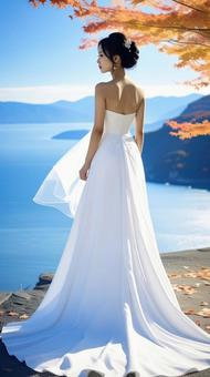 秋の紅葉の中のウェデイングドレス姿の花嫁 秋の紅葉の中のウェデイングドレス姿の花嫁の写真