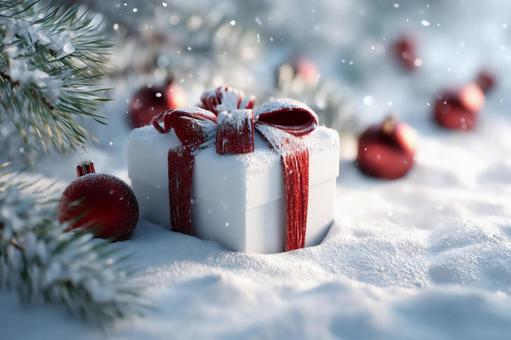 雪の中の赤いリボン付きクリスマスギフト 雪の中の赤いリボン付きクリスマスギフトの写真