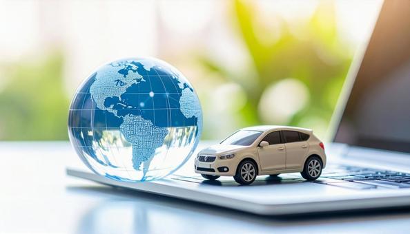 ガラスの地球儀とミニチュアの車 ガラスの地球儀とミニチュアの車の写真