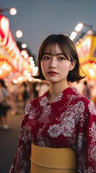 夜祭に遊びに来た赤い浴衣の女性 夜祭に遊びに来た赤い浴衣の女性の写真