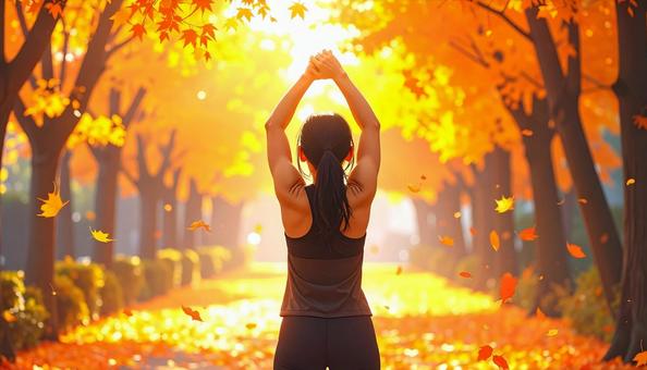 スポーツの秋 紅葉の中でストレッチ 女性 スポーツの秋 紅葉の中でストレッチ 女性の写真