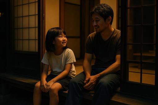 夏の縁側でくつろぐ親子 夏の縁側でくつろぐ親子の写真