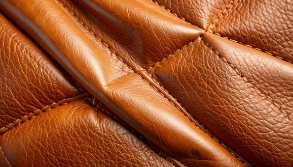 レンガ色のリアルな質感のレザーの背景の写真