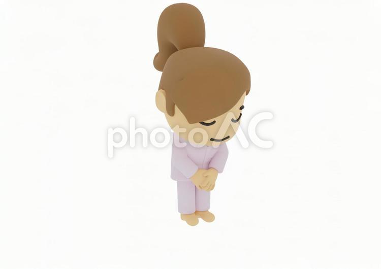 頭を下げてお辞儀するパジャマ若い女性患者 介護,入院,病気の写真素材