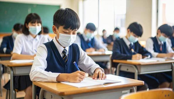 入試を受けている男子学生 入試を受けている男子学生の写真