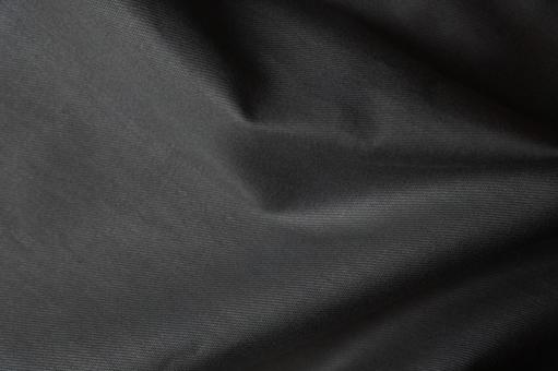 黒布のシワ質感背景の写真