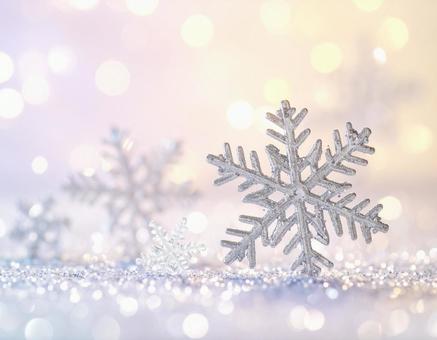 大きな雪の結晶と柔らかな光の背景 大きな雪の結晶と柔らかな光の背景の写真