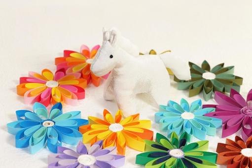 カラフルな紙の花とちりめんで作った白馬 年賀状,午年,白馬の写真素材