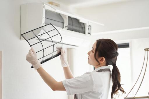 Woman cleaning the air conditioner filter, JPG Woman cleaning the air conditioner filter, air conditioner, filter, clean up, JPG
