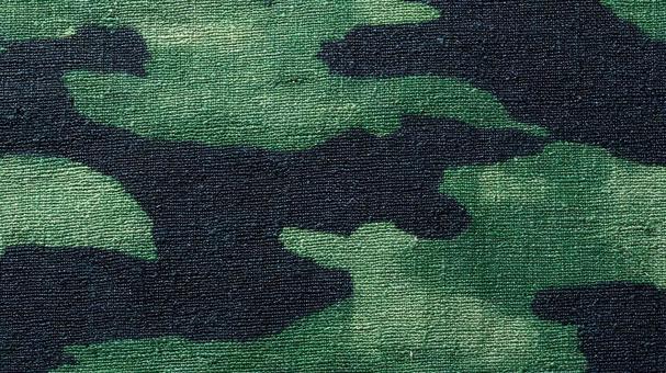 緑色の迷彩柄の生地_1の写真