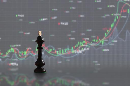 チェスの駒と株価のグラフ チェスの駒と株価のグラフの写真