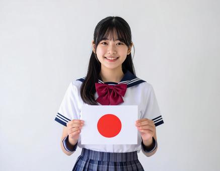 日の丸の国旗を持った女子生徒のイメージ 日の丸の国旗を持った女子生徒のイメージの写真