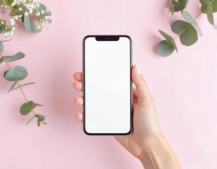 スマートフォンを持つ手の写真