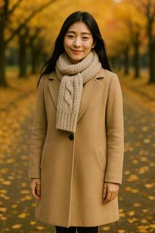 マフラーを整える女性のポートレート(秋) マフラーを整える女性のポートレート(秋)の写真