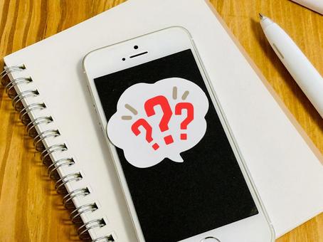 スマホとクエスチョンマーク スマホとクエスチョンマーク わからない,調べる,検索の写真素材