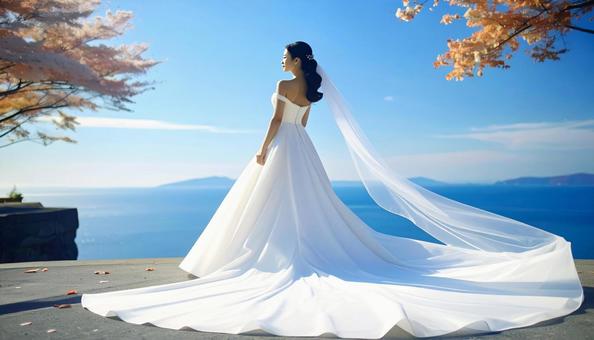 秋の紅葉の中のウェデイングドレス姿の花嫁 秋の紅葉の中のウェデイングドレス姿の花嫁の写真