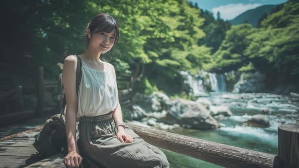 夏の深緑と清流と若い女性 夏の深緑と清流と若い女性の写真