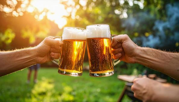 ビールで乾杯するバーベキュー ビールで乾杯するバーベキューの写真