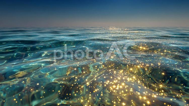 光の粒がきらめく、穏やかな海の景色 海,水面,太陽の写真素材