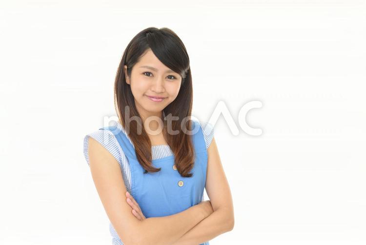 エプロンを着た笑顔の女性 女性,女,主婦の写真素材