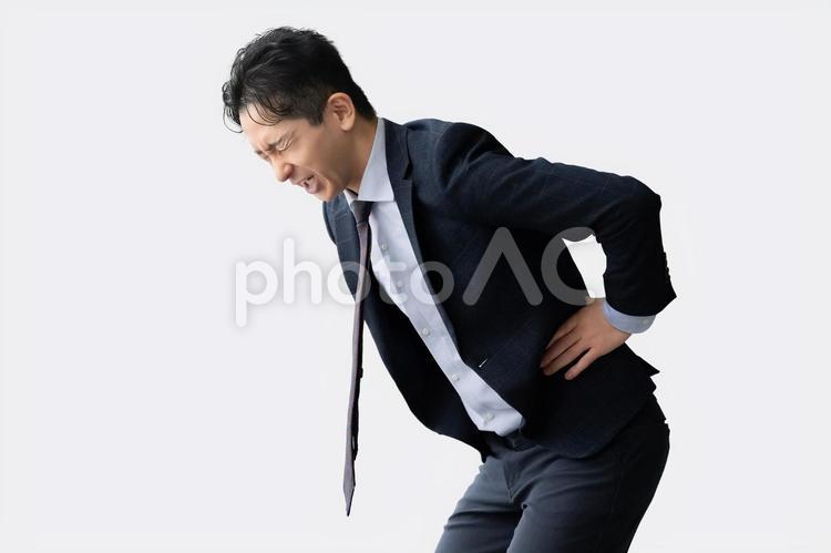 腰痛に悩まされる男性ビジネスマン 男性,腰痛,腰の写真素材