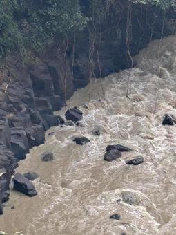 豪雨後の川 川,山,木の写真素材