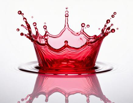 赤く透明な液体のミルククラウンと波紋 赤く透明な液体のミルククラウンと波紋の写真