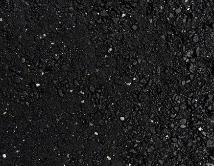 小石が混じった黒い道路のテクスチャ 小石が混じった黒い道路のテクスチャの写真