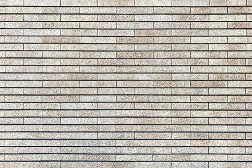 横長タイルが整然と並ぶ壁面テクスチャ 壁,壁面,タイル壁の写真素材