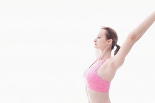 ストレッチをする笑顔の若い女性 コンディション,先生,海外の写真素材