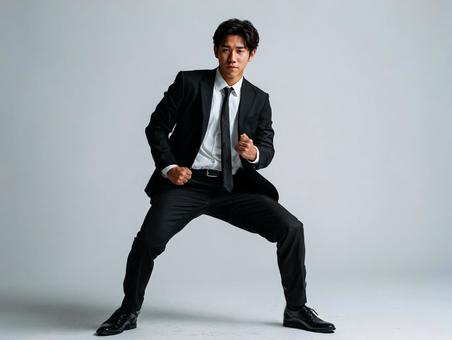 ポーズを決める若い男性ビジネスマン ポーズを決める若い男性ビジネスマンの写真