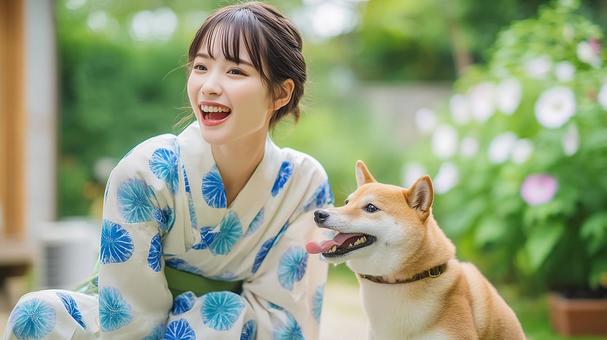 朝顔柄の浴衣を着た女性と柴犬と朝顔 朝顔柄の浴衣を着た女性と柴犬と朝顔の写真