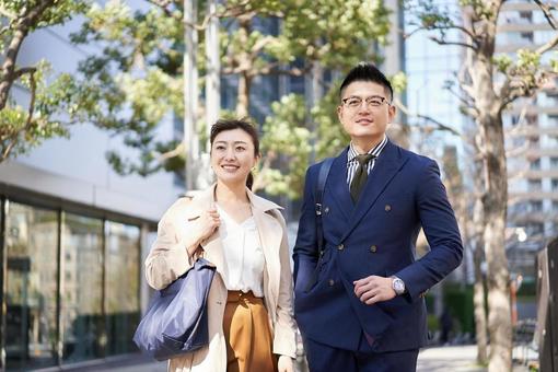 Asian business person walking in the business district, businessman, business woman, business, JPG