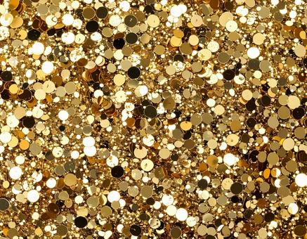 キラキラ光るスパンコールの背景素材の写真