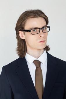 スーツにメガネでカメラ目線の男性 男性,外国人,欧米人の写真素材