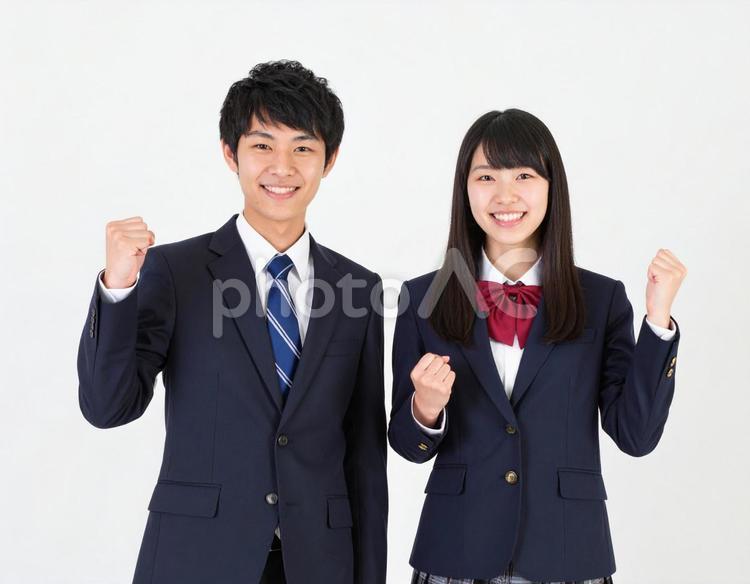 ガッツポーズでエールを送る男女高校生 高校生,男女,生徒の写真素材