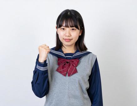 ガッツポーズをする女子生徒のイメージ ガッツポーズをする女子生徒のイメージの写真