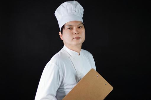 白いコック服の料理人 白いコック服の料理人の写真