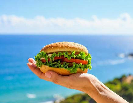 夏の浜辺でハンバーガー 夏の浜辺でハンバーガーの写真