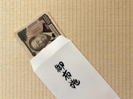 御布施　三回忌　一万円のお布施を入れる お布施,一万円,壱万円の写真素材