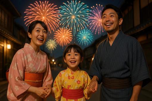 花火を見上げる日本人家族 花火を見上げる日本人家族の写真