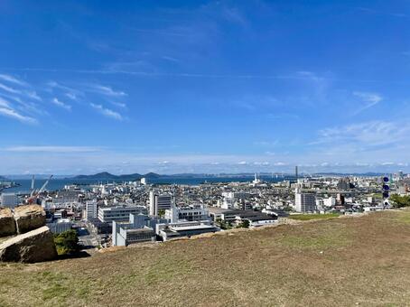 香川県丸亀城から望む市街地 丸亀市,瀬戸内海,市街地の写真素材