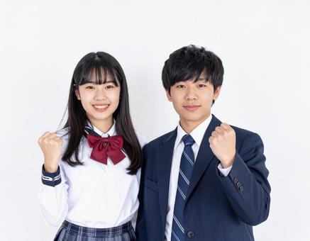 ガッツポーズする男子生徒と女子生徒 ガッツポーズする男子生徒と女子生徒の写真