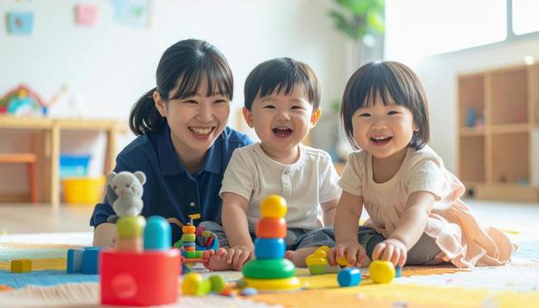 笑顔の保育士と遊ぶ子どもたちの写真
