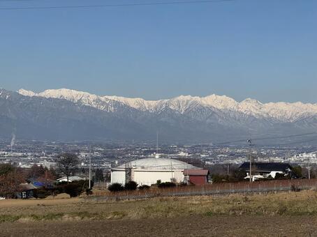 12月の北アルプスと片丘給水池 山,信州,風景の写真素材