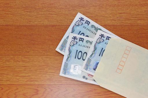 茶封筒に入れた千円札 茶封筒に入れた千円札 茶封筒,封筒,クラフト封筒の写真素材