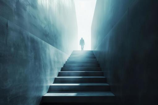 光へ向かう階段と静かな人影の写真