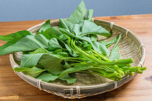 竹ざるに盛った空芯菜 竹ざるに盛った空芯菜 空芯菜,野菜,くうしんさいの写真素材