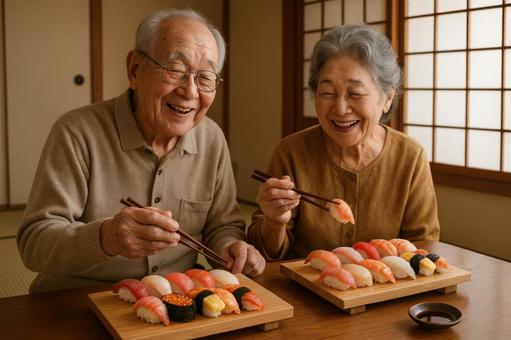 お寿司を囲む高齢夫婦 お寿司を囲む高齢夫婦の写真