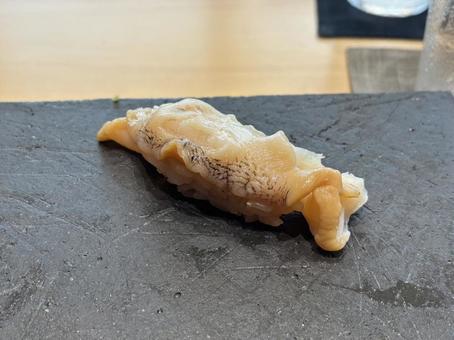 活きの良さが段違い。高級つぶ貝の握り つぶ貝,つぶ貝握り,貝の写真素材